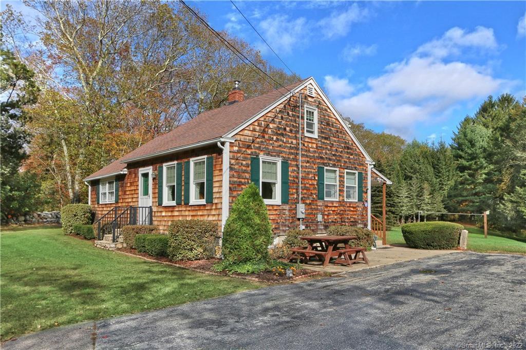 128 Pumpkin Hill Road Groton, CT 06355 - Photo 1 of 1 a view of a house with a yard and sitting area