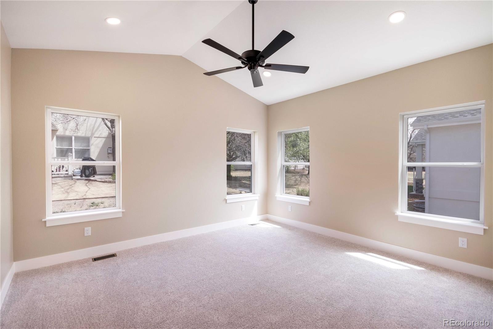 1220 Swainson Road Eaton, CO 80615 - Photo 20 of 35 a view of a livingroom with a ceiling fan and window