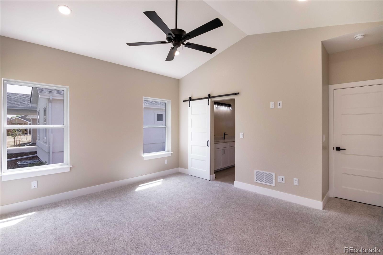 1220 Swainson Road Eaton, CO 80615 - Photo 21 of 35 a view of a livingroom with a ceiling fan and window