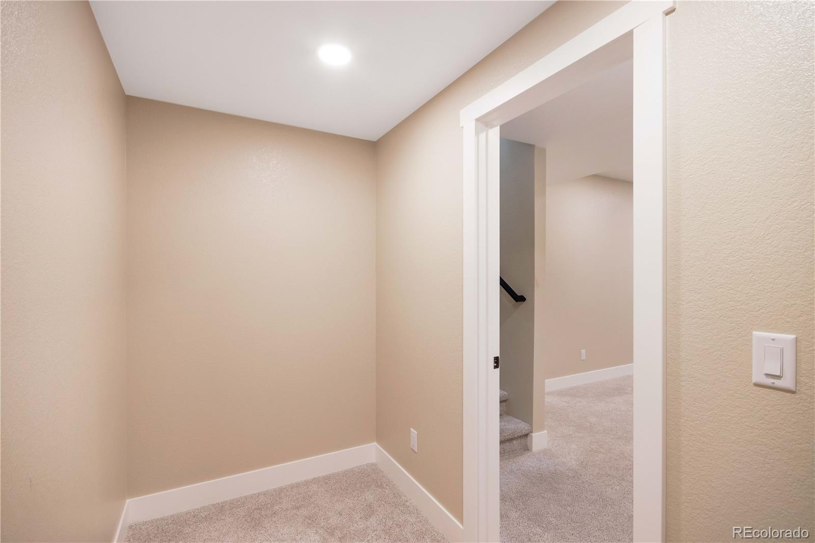1220 Swainson Road Eaton, CO 80615 - Photo 31 of 35 an empty room with an entryway