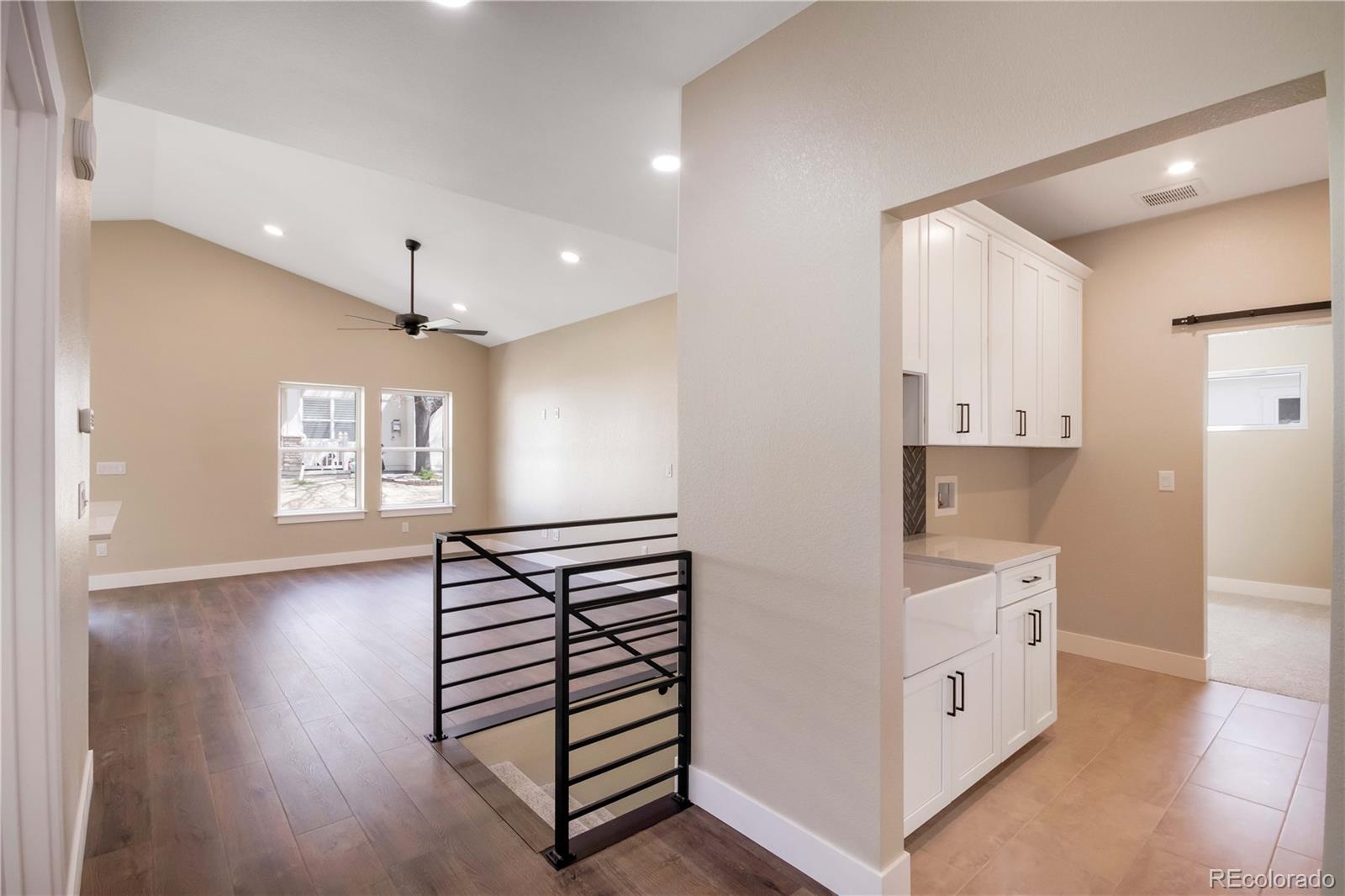 1220 Swainson Road Eaton, CO 80615 - Photo 5 of 35 a view of kitchen with stainless steel appliances cabinets and wooden floor