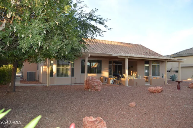 a front view of a house with sitting space