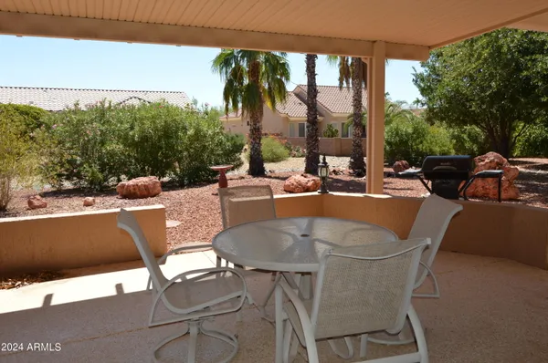 a view of a patio with swimming pool