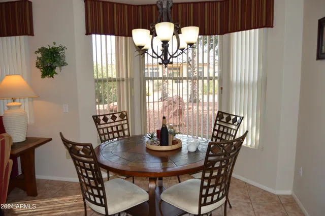 a view of a dining room with furniture and window