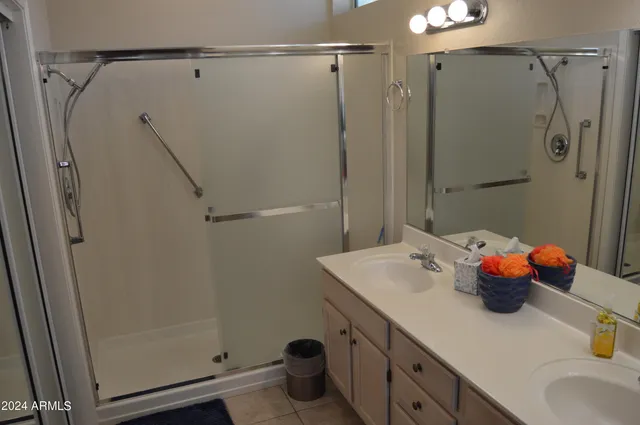 a bathroom with a sink shower and a tub