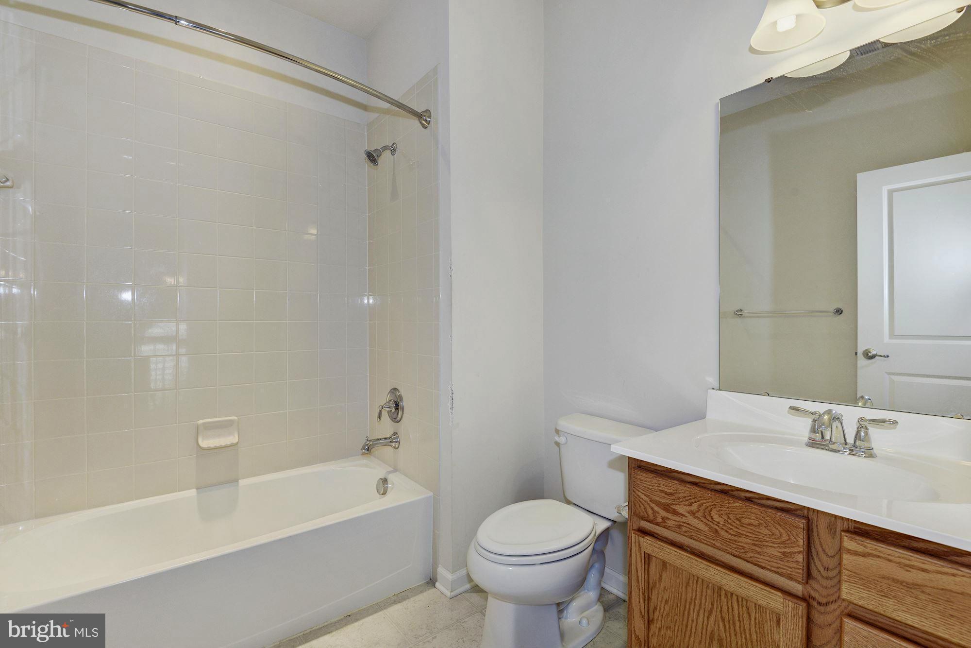 2644 St Marys View Road Accokeek, MD 20607 - Photo 20 of 29 a bathroom with a sink a toilet and a bathtub