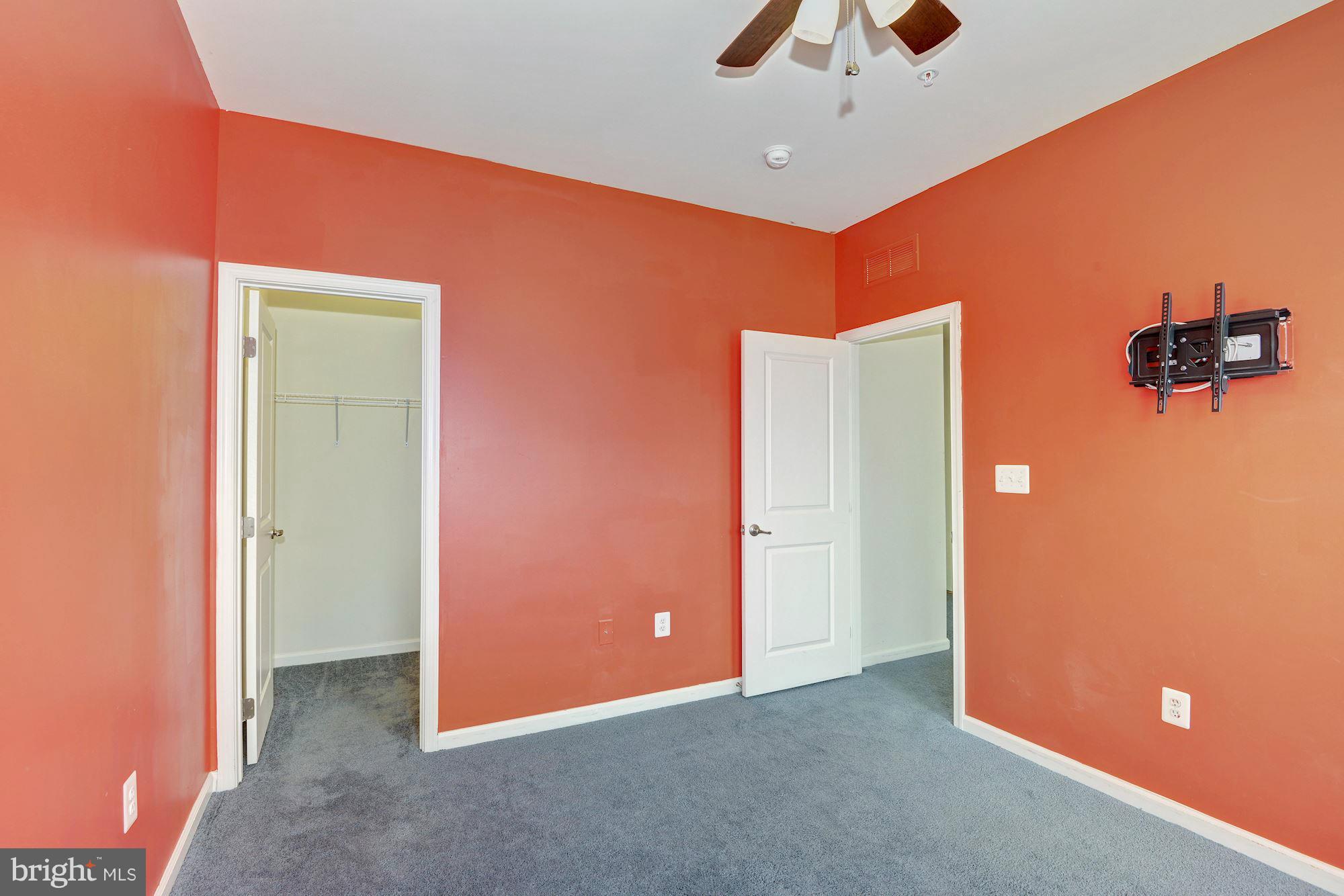 2644 St Marys View Road Accokeek, MD 20607 - Photo 22 of 29 an empty room with closet and a chandelier fan