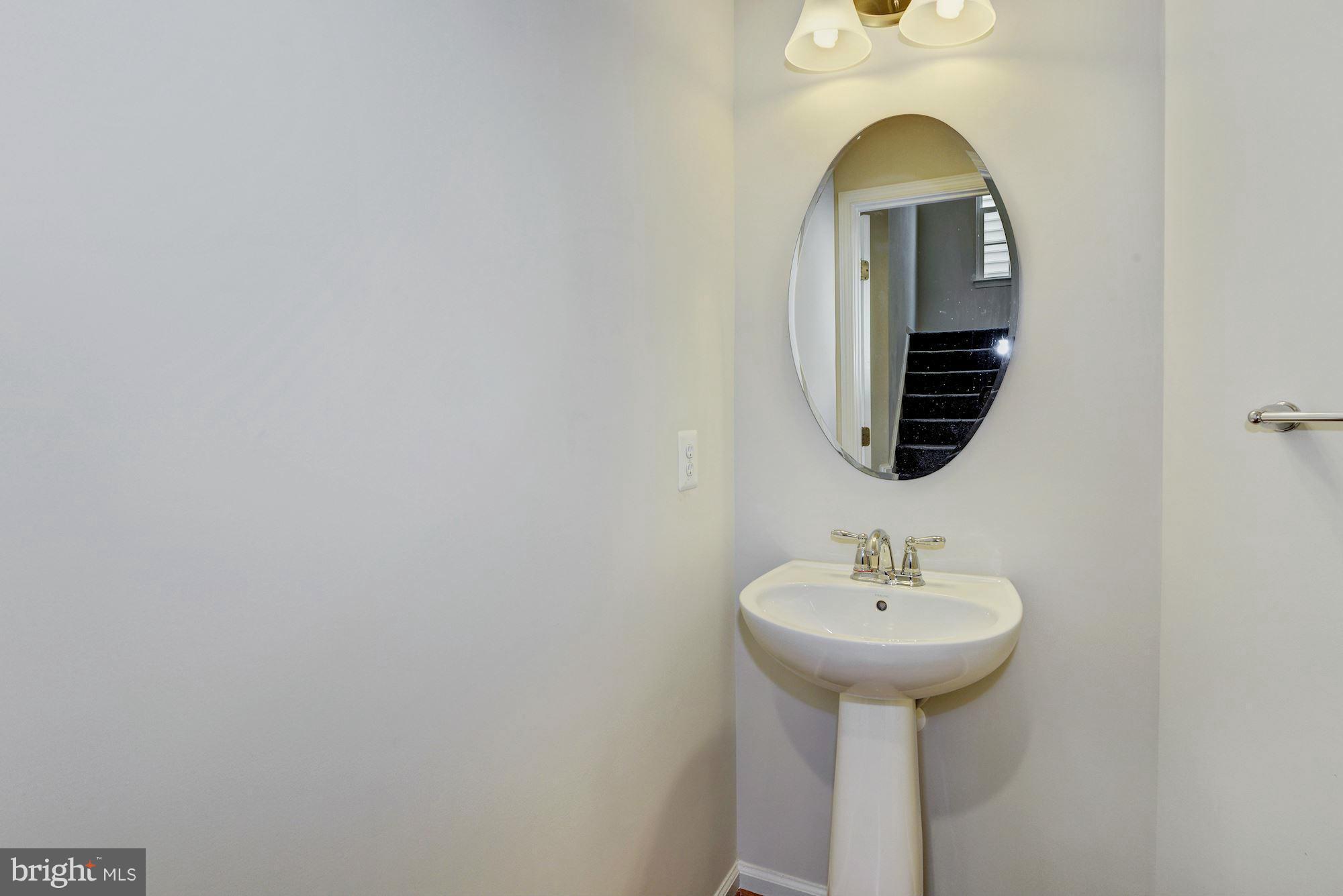 2644 St Marys View Road Accokeek, MD 20607 - Photo 26 of 29 a bathroom with a sink and a mirror