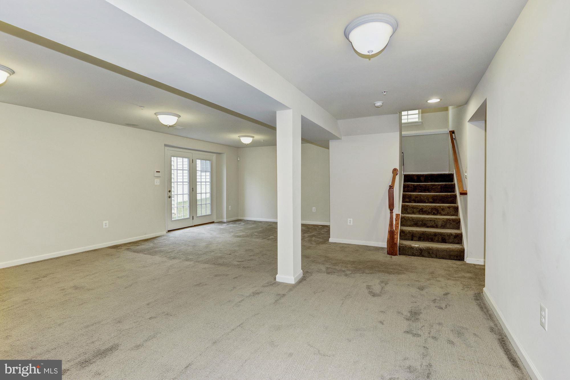 2644 St Marys View Road Accokeek, MD 20607 - Photo 27 of 29 an empty room with wooden floor and white walls