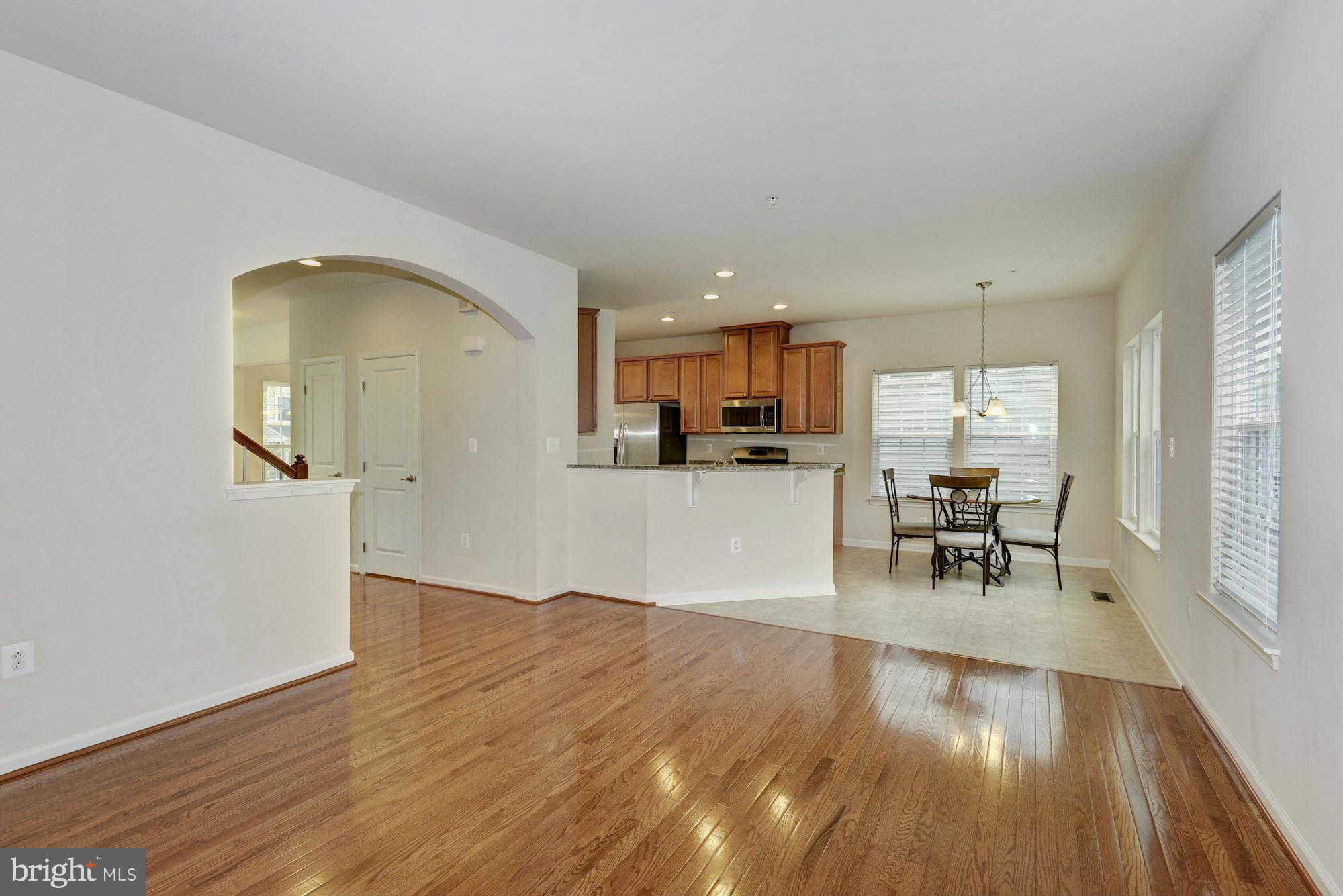 2644 St Marys View Road Accokeek, MD 20607 - Photo 10 of 29 a view of a living room with kitchen and hardwood floor
