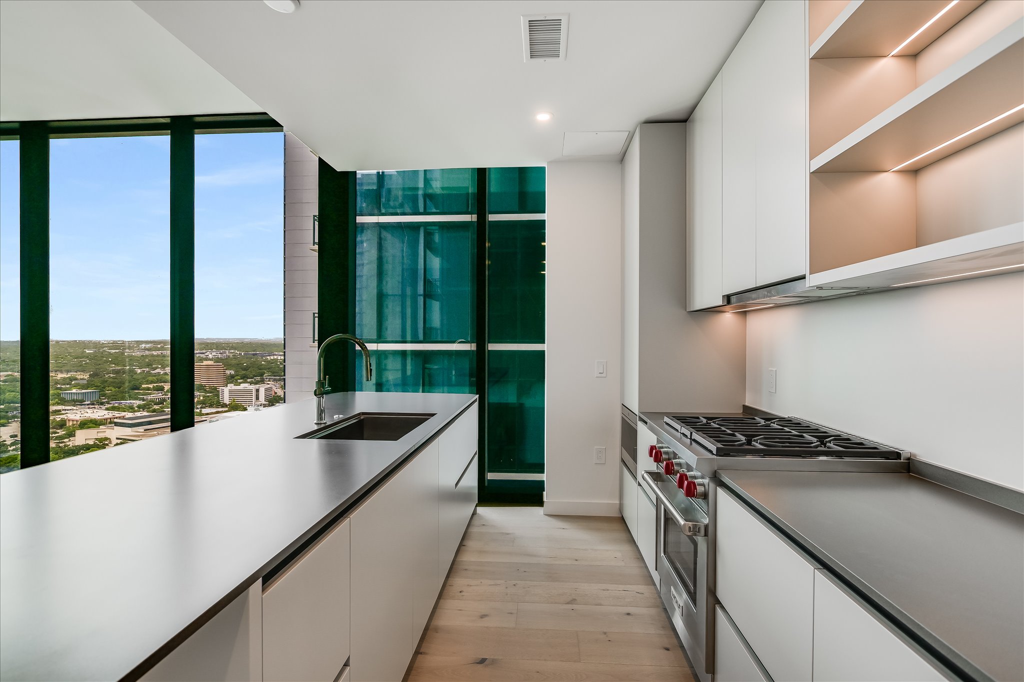610 Davis Street, Unit 2705 Austin, TX 78701 - Photo 7 of 33 a kitchen with counter top space and stainless steel appliances