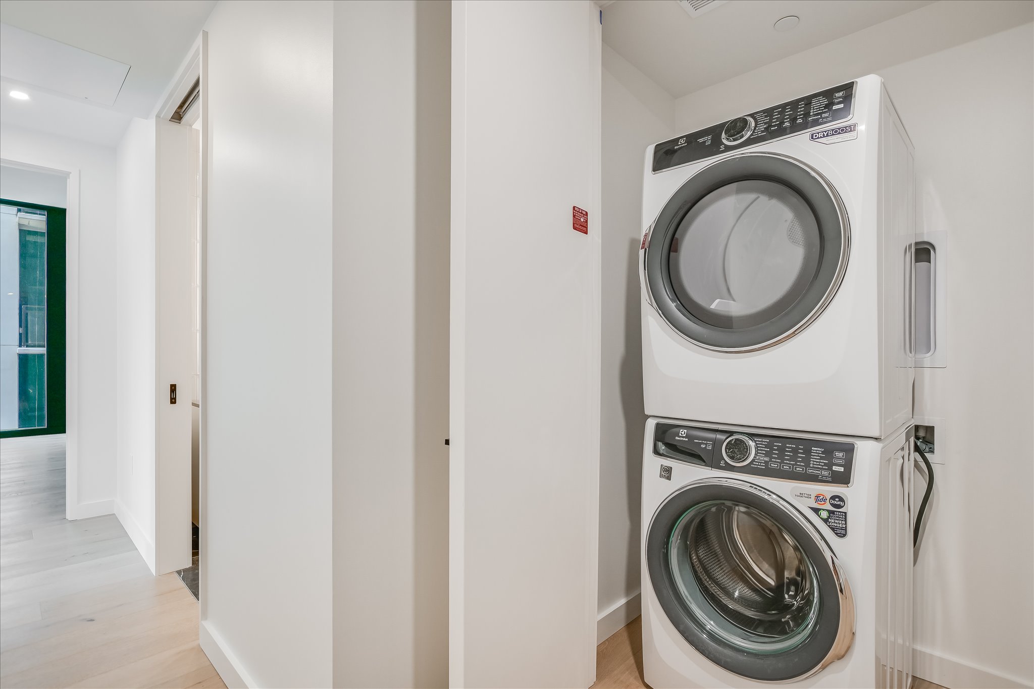 610 Davis Street, Unit 2705 Austin, TX 78701 - Photo 8 of 33 a view of a hallway with washer and dryer