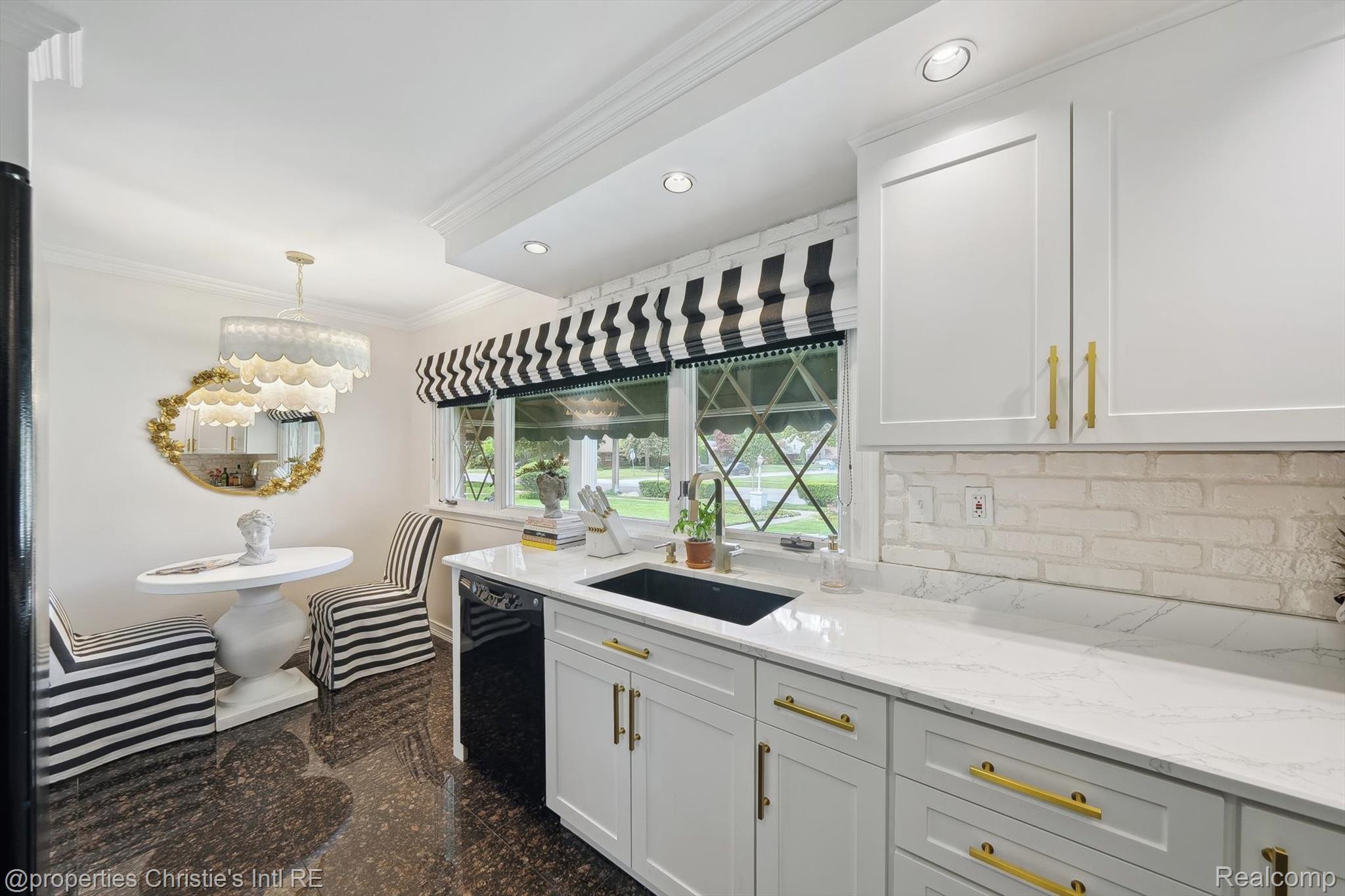 511 South Gulley Road Dearborn, MI 48124 - Photo 19 of 43 White shaker cabinetry with gold-tone hardware, white countertop surfaces, white brick-style backsplash, recessed lighting, and a built-in dishwasher