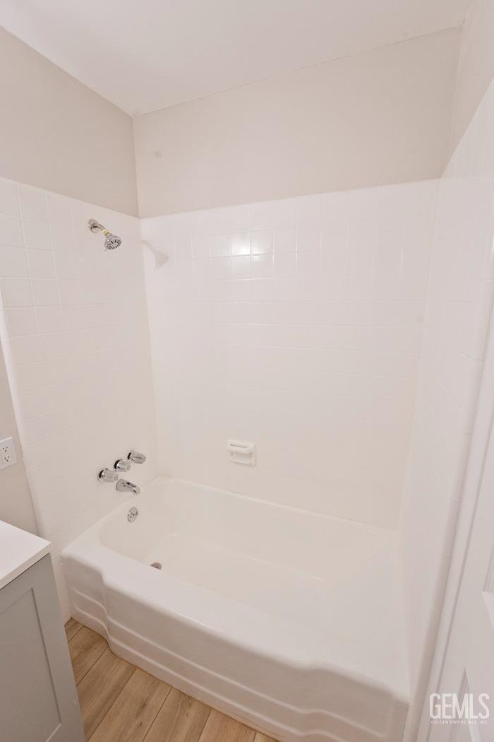 Undisclosed Address Bakersfield, CA 93304 - Photo 11 of 20 a bathroom with a bathtub