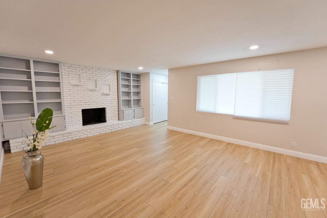 Undisclosed Address Bakersfield, CA 93304 - Photo 16 of 20 a living room with furniture and a fireplace