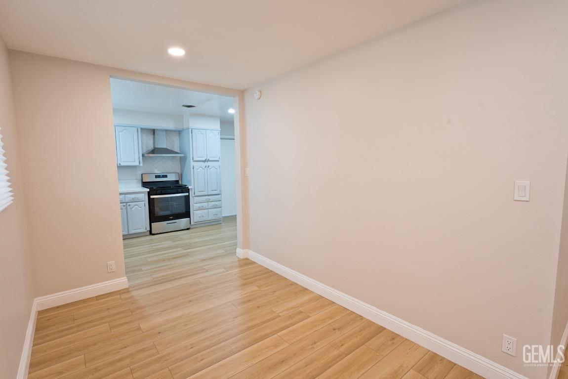 Undisclosed Address Bakersfield, CA 93304 - Photo 4 of 20 a view of empty room with wooden floor