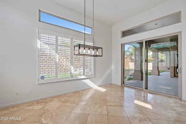a view of an empty room with glass door