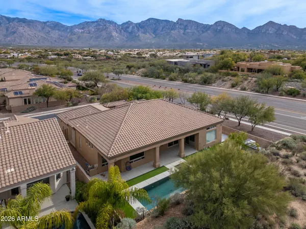 a view of a house with a mountain in the background