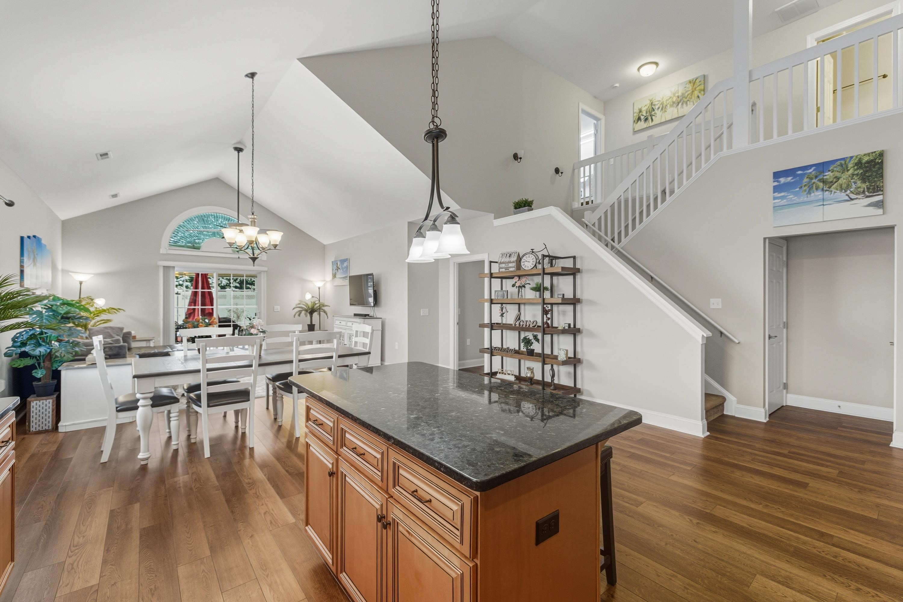 470 Callaway Circle Harrisonburg, VA 22801 - Photo 11 of 73 a view of a dining room and livingroom with furniture wooden floor a chandelier