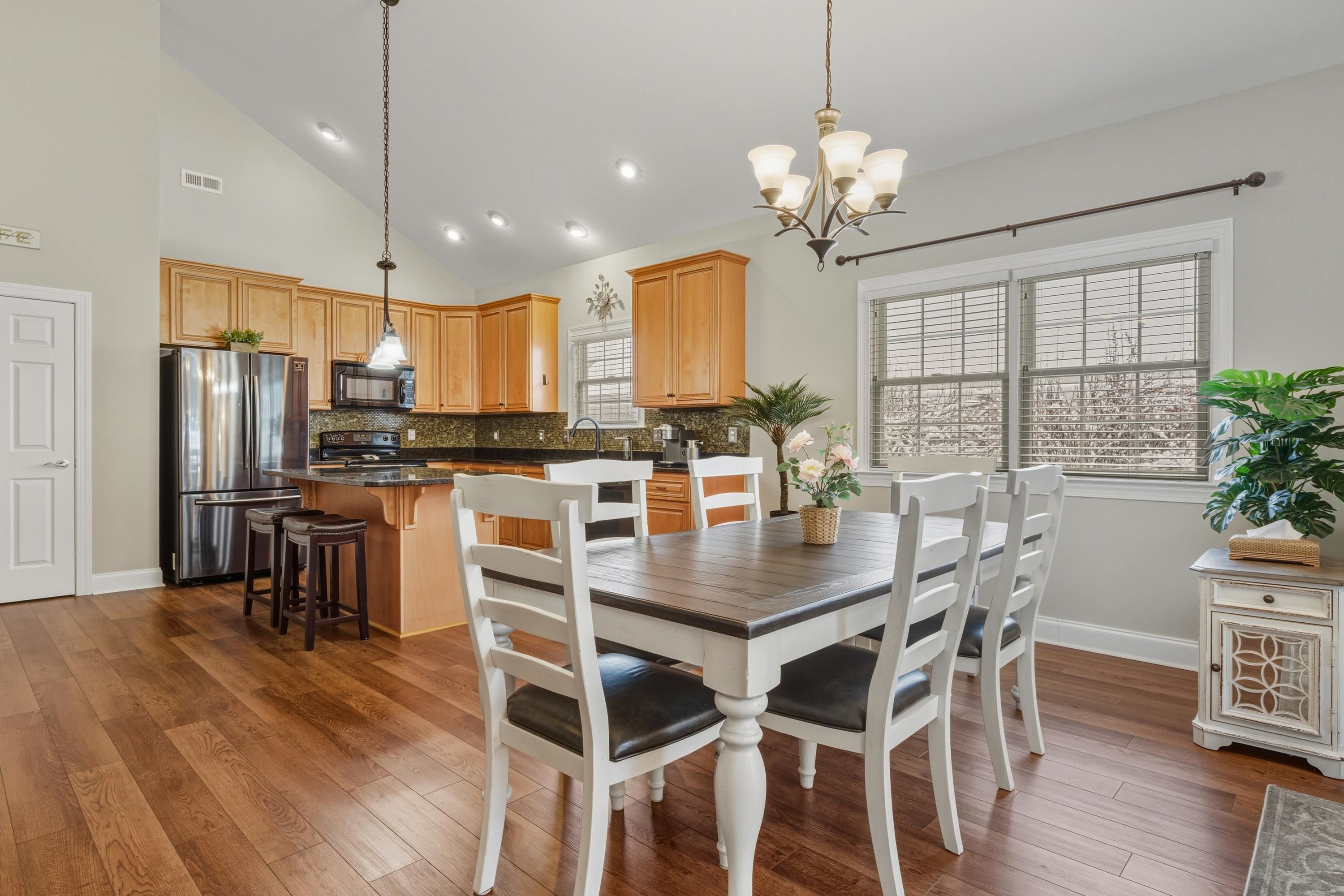470 Callaway Circle Harrisonburg, VA 22801 - Photo 14 of 73 Directly off the kitchen space is a dining area featuring elevated ceilings, chandelier, and plenty of space for a table & chairs set.