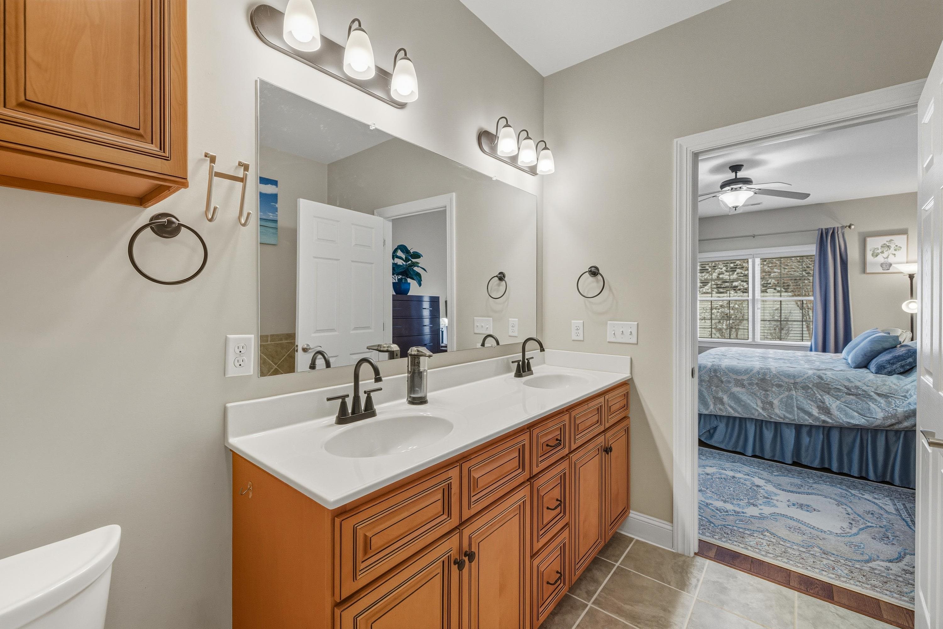 470 Callaway Circle Harrisonburg, VA 22801 - Photo 28 of 73 The primary bathroom offers ceramic tile flooring, dual vanities, tiled bathtub, and tile walk-in shower space.