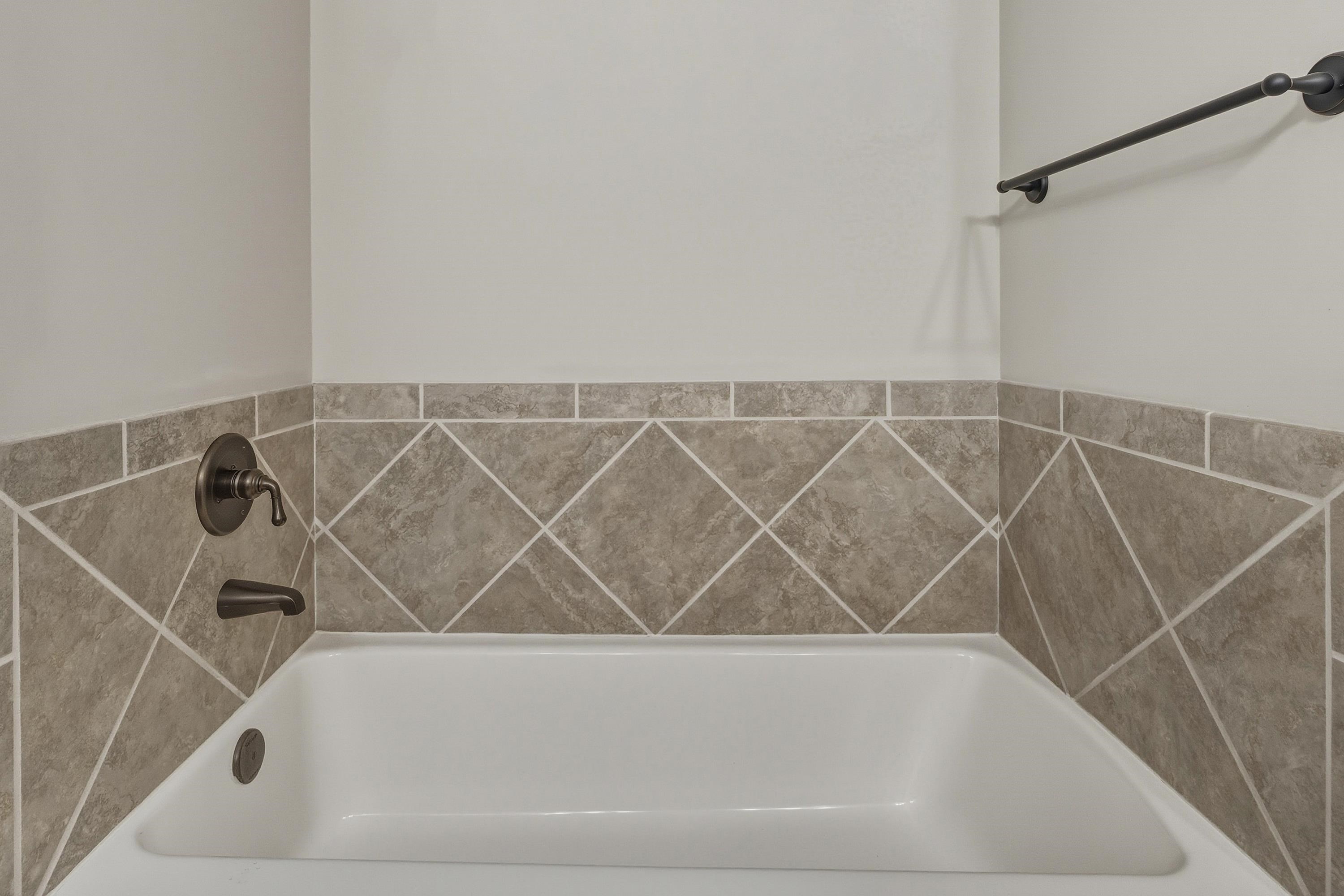 470 Callaway Circle Harrisonburg, VA 22801 - Photo 30 of 73 The primary bathroom offers ceramic tile flooring, dual vanities, tiled bathtub, and tile walk-in shower space.