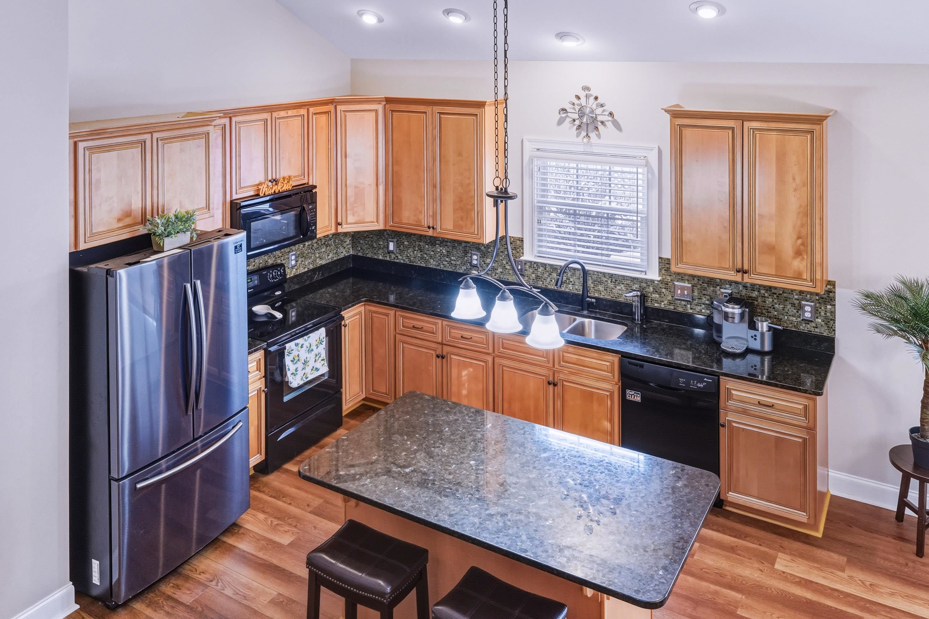 470 Callaway Circle Harrisonburg, VA 22801 - Photo 5 of 73 a kitchen with stainless steel appliances granite countertop a sink stove and refrigerator
