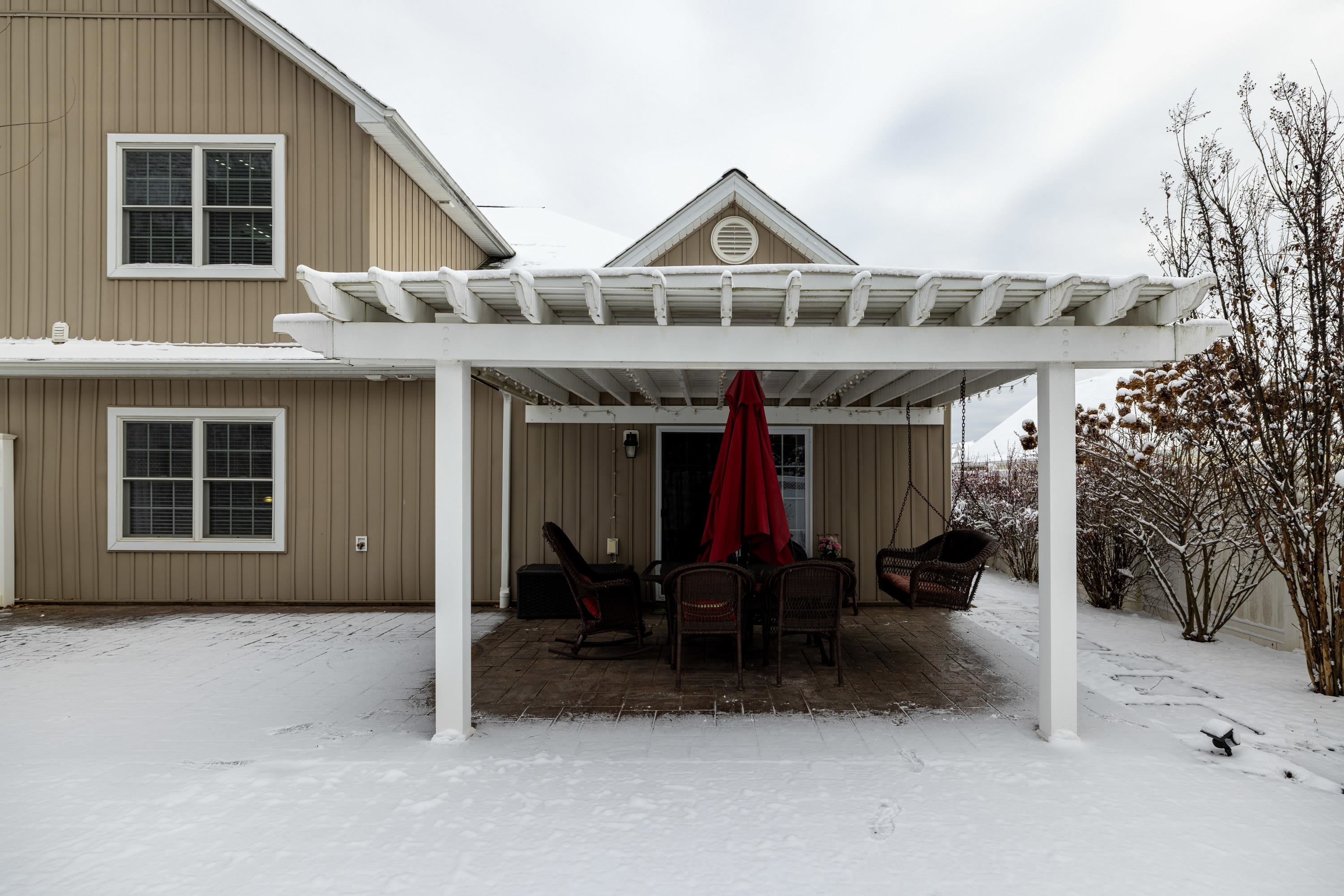 470 Callaway Circle Harrisonburg, VA 22801 - Photo 57 of 73 The backyard of the home features a large patio and covered patio area. The backyard offers mature landscaping, a mostly level lot, and is fully fenced with yinyl fencing.