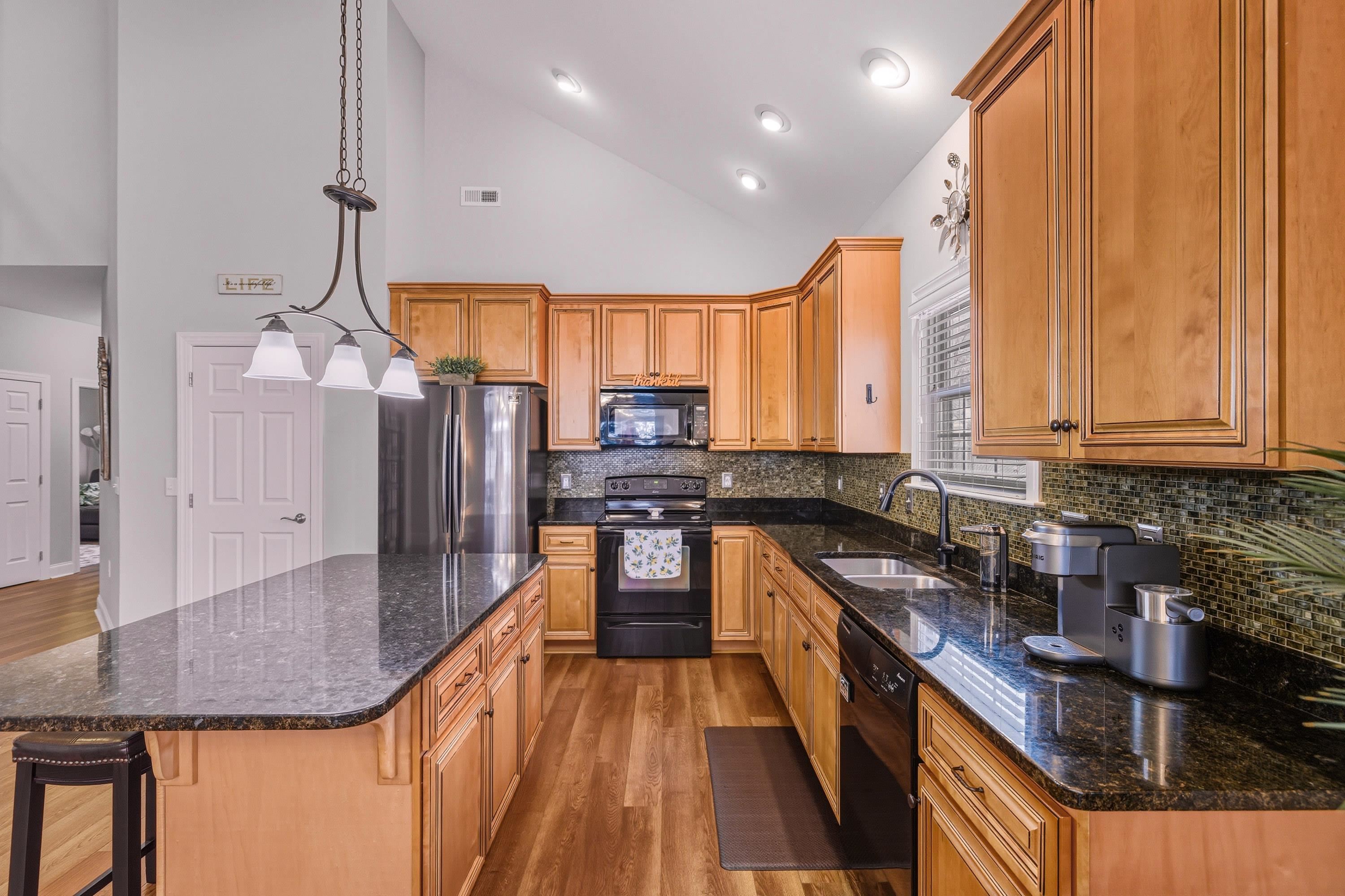470 Callaway Circle Harrisonburg, VA 22801 - Photo 7 of 73 a kitchen with stainless steel appliances granite countertop a sink a stove top oven a counter space and cabinets