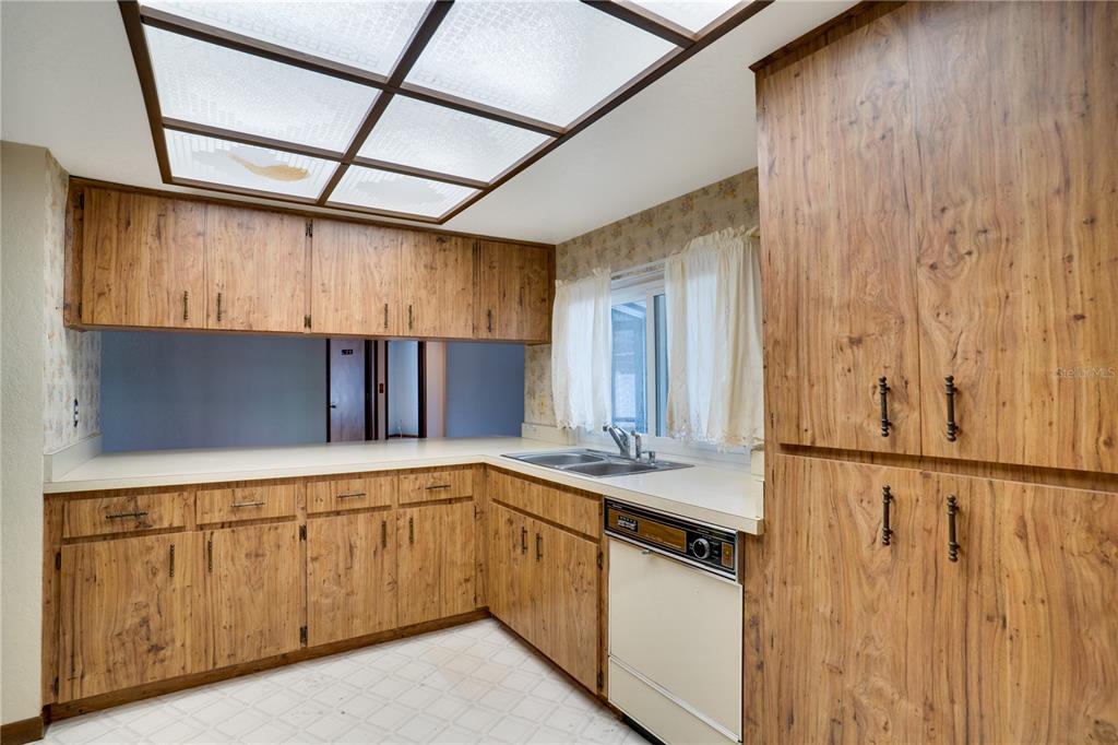 12161 100th Avenue Seminole, FL 33772 - Photo 12 of 34 a kitchen with a sink and cabinets