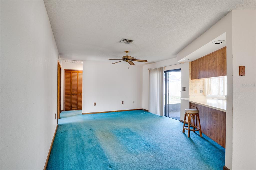 12161 100th Avenue Seminole, FL 33772 - Photo 14 of 34 wooden floor in an empty room with a window