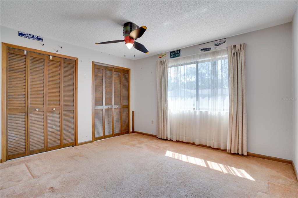 12161 100th Avenue Seminole, FL 33772 - Photo 15 of 34 a view of an empty room with a window
