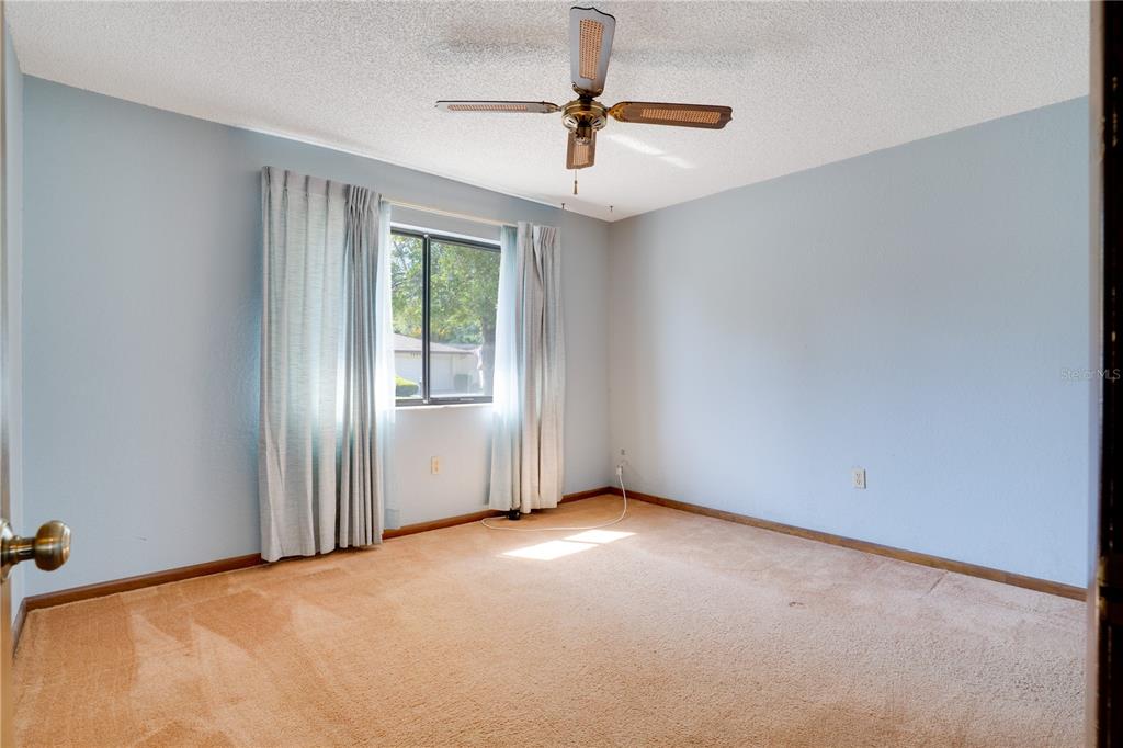 12161 100th Avenue Seminole, FL 33772 - Photo 21 of 34 a view of an empty room with a window