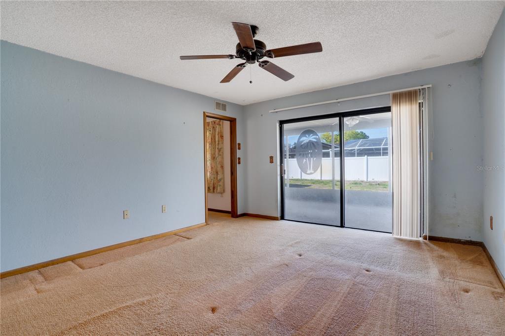 12161 100th Avenue Seminole, FL 33772 - Photo 23 of 34 a view of empty room with ceiling fan