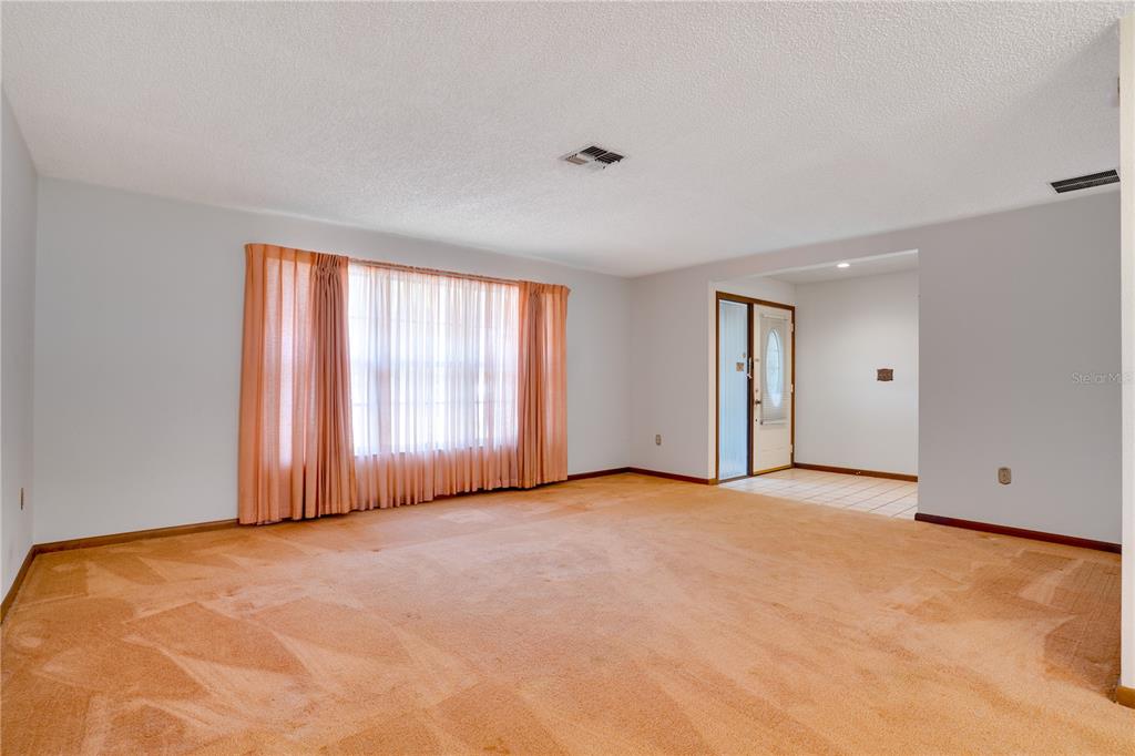 12161 100th Avenue Seminole, FL 33772 - Photo 26 of 34 a view of an empty room with windows