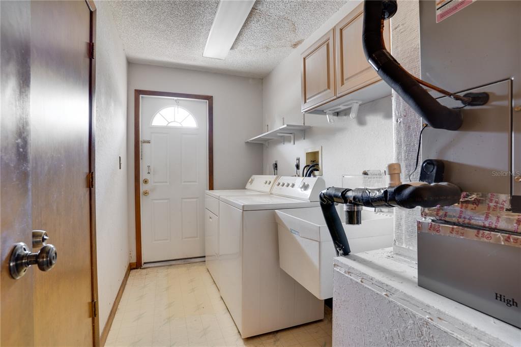 12161 100th Avenue Seminole, FL 33772 - Photo 28 of 34 a room with storage and utility