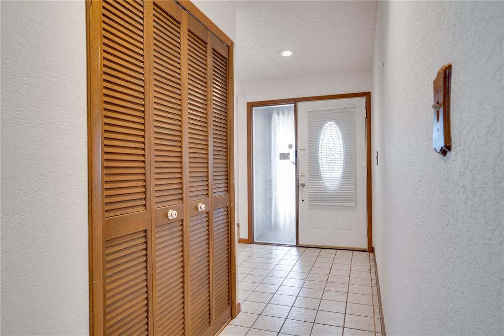 12161 100th Avenue Seminole, FL 33772 - Photo 9 of 34 a view of hallway with wooden floor