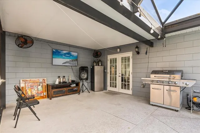 a view of a livingroom with furniture and a kitchen
