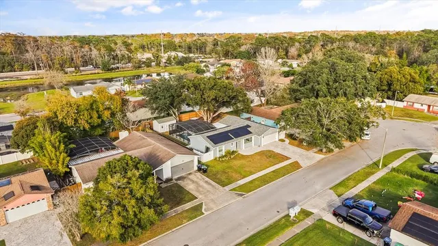 an aerial view of residential houses with outdoor space
