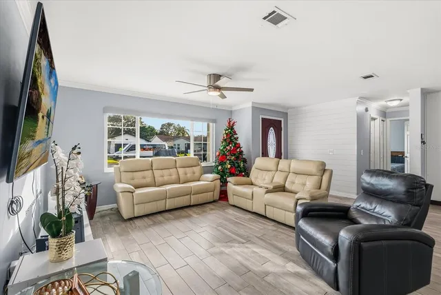 a living room with furniture fireplace and a flat screen tv
