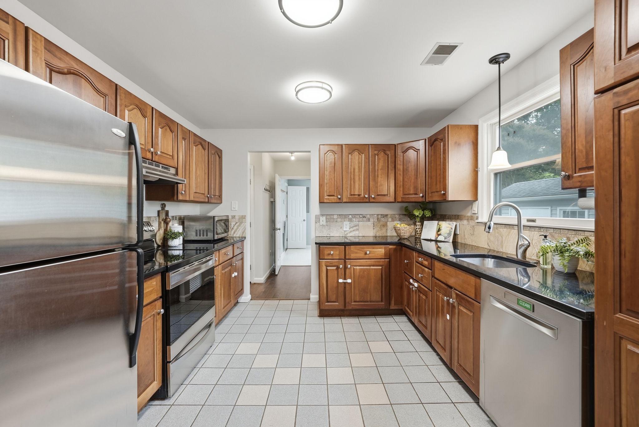 3008 Findley Road Kensington, MD 20895 - Photo 12 of 31 Kitchen with rich wood cabinetry.
