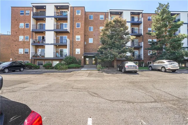 a car parked in front of a brick building