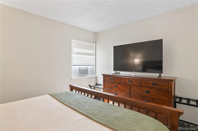 a living room with furniture and flat screen tv