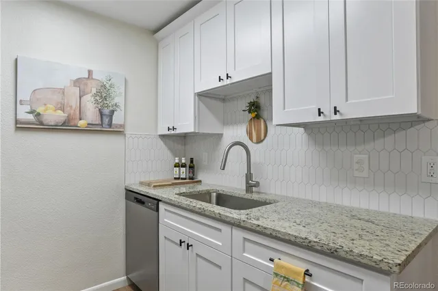 a kitchen with a sink and cabinets