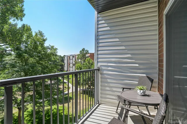 a view of a balcony with chairs
