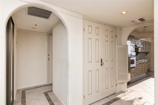 a kitchen with stainless steel appliances granite countertop a sink a stove and a refrigerator