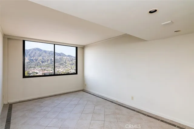 a bathroom with a granite countertop sink a mirror a bathtub and vanity