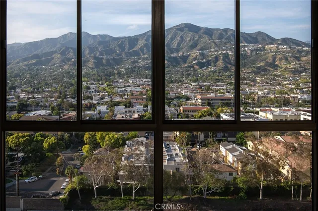 an aerial view of residential building and trees