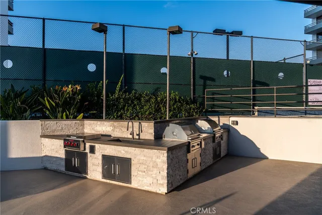 a view of a swimming pool with a patio and a yard