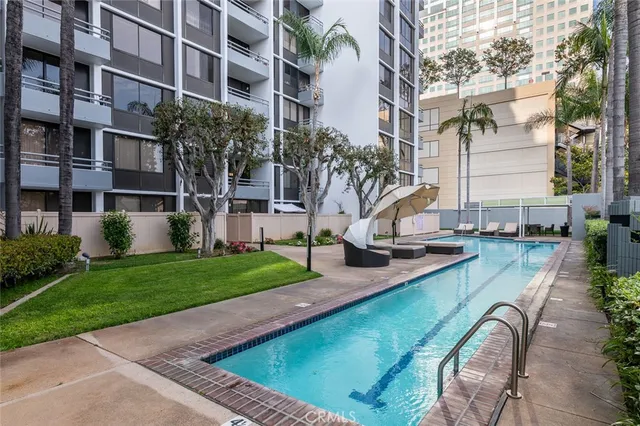 a view of a building with a garden and plants